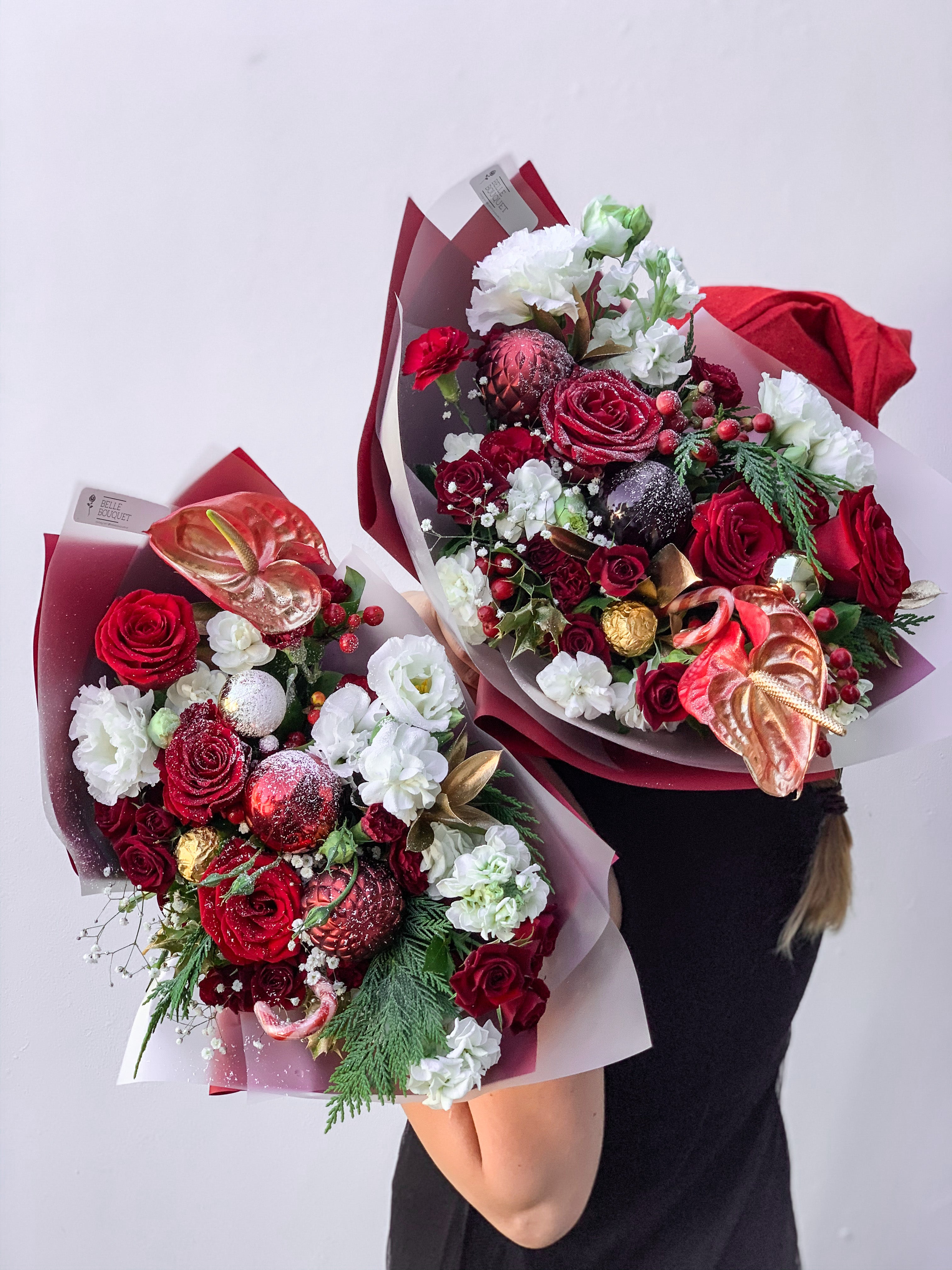 Red and white Christmas flowers with frosted effect decoration 