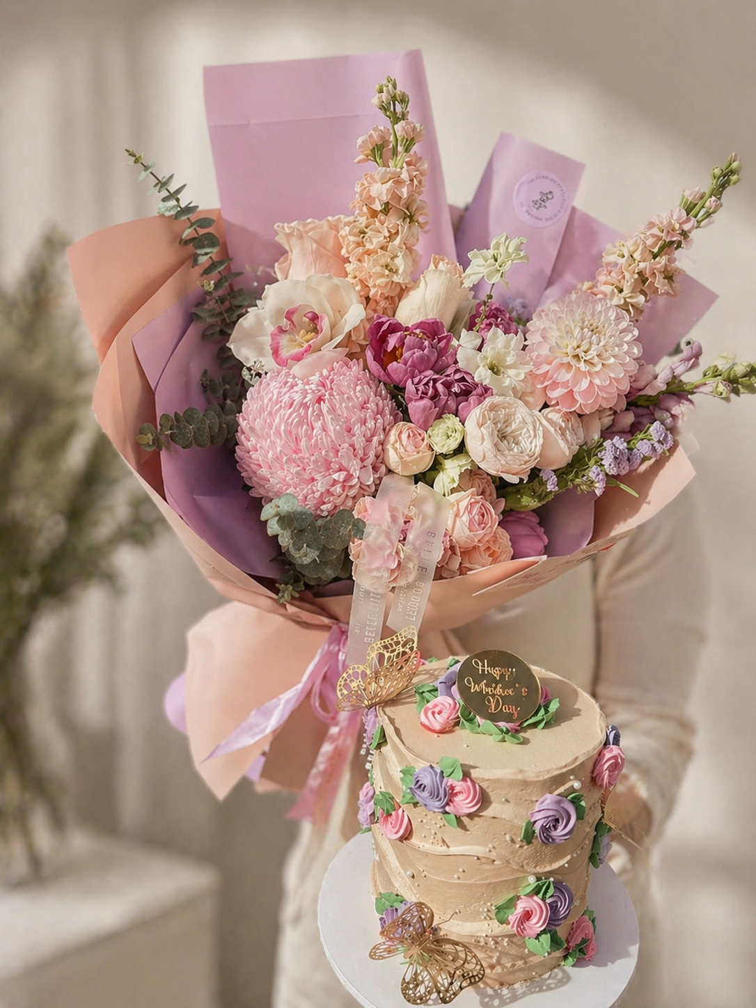 Bouquet of flowers and a decorated cake 