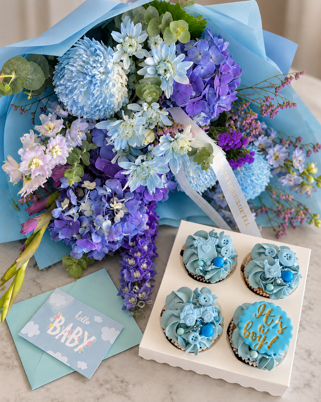 Hello Baby Boy flowers and cupcakes gift set with a blue and purple bouquet